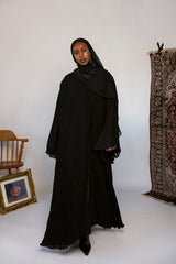 Full-length pleated abaya crafted from soft fabric with all-over flowing pleats.