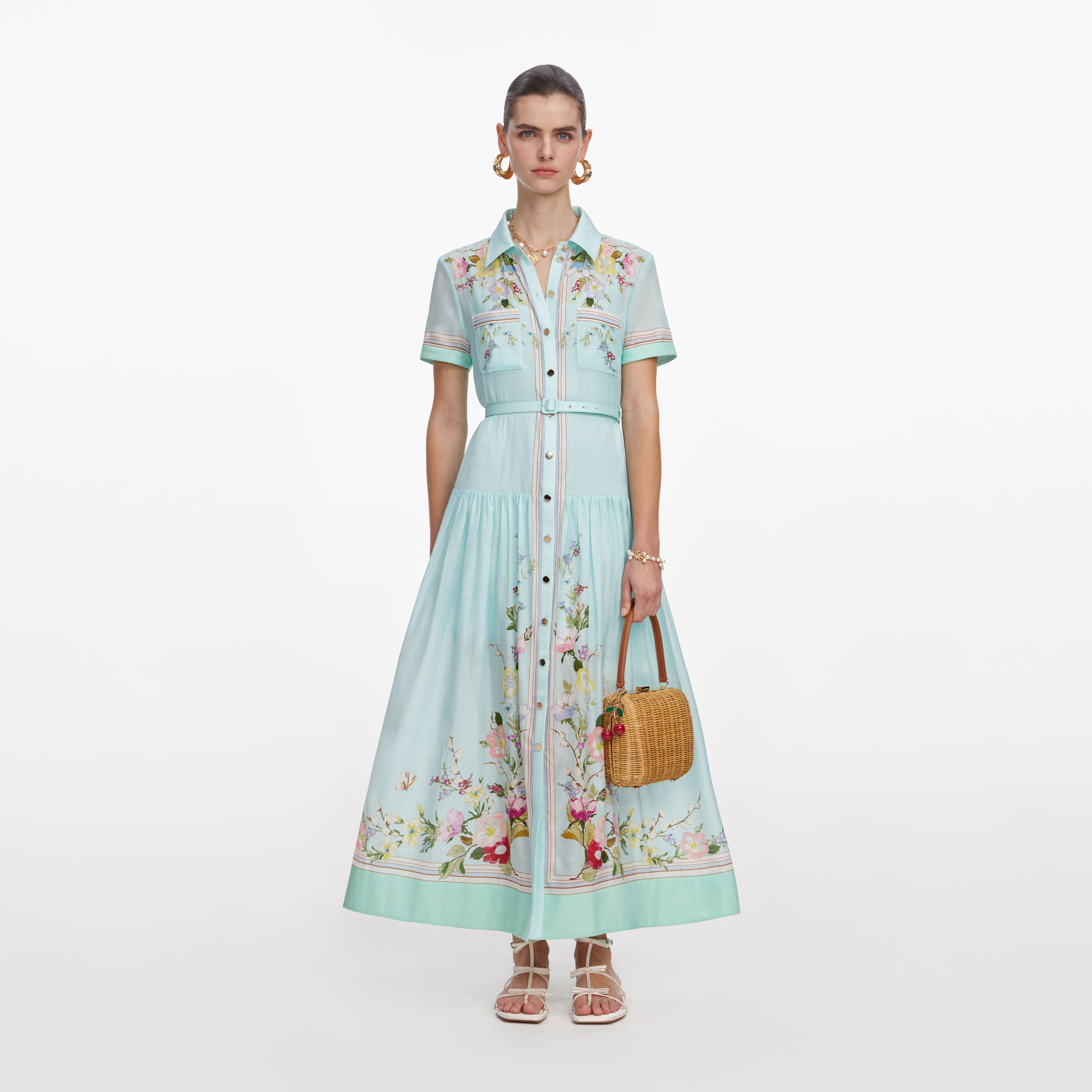 Front view of a woman wearing the Mint Floral Organza Midi Dress