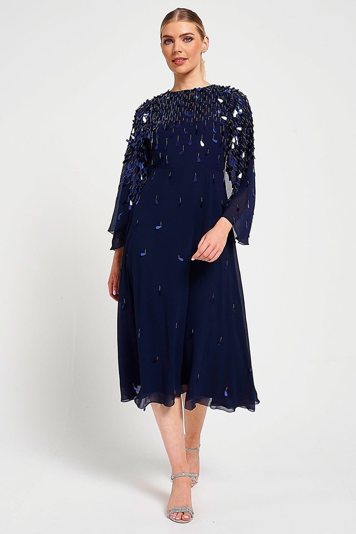 Annette navy embellished cape sleeve midi dress with tonal sequin detailing and flowing silhouette designed for elegant wedding guest and occasion wear styling