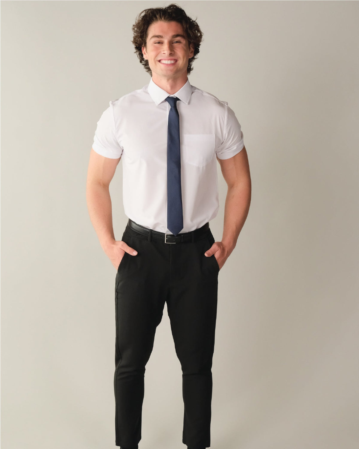 Man wearing a short sleeve white dress shirt with blue tie