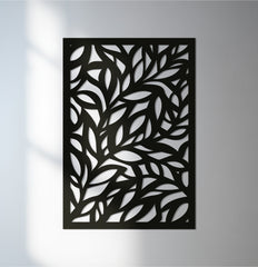 Soft, diffused light graces the unique metal wall art panel, highlighting the botanical leaf sculpture's intricate design and adding subtle depth.