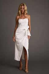 White satin strapless, wrap wrap dress with satin accents, a white sequin dress essential.