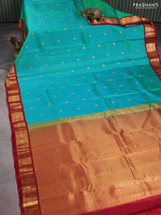 Pure kanchipuram silk saree dual shade of teal green and maroon with zari woven buttas and annam zari woven korvai border