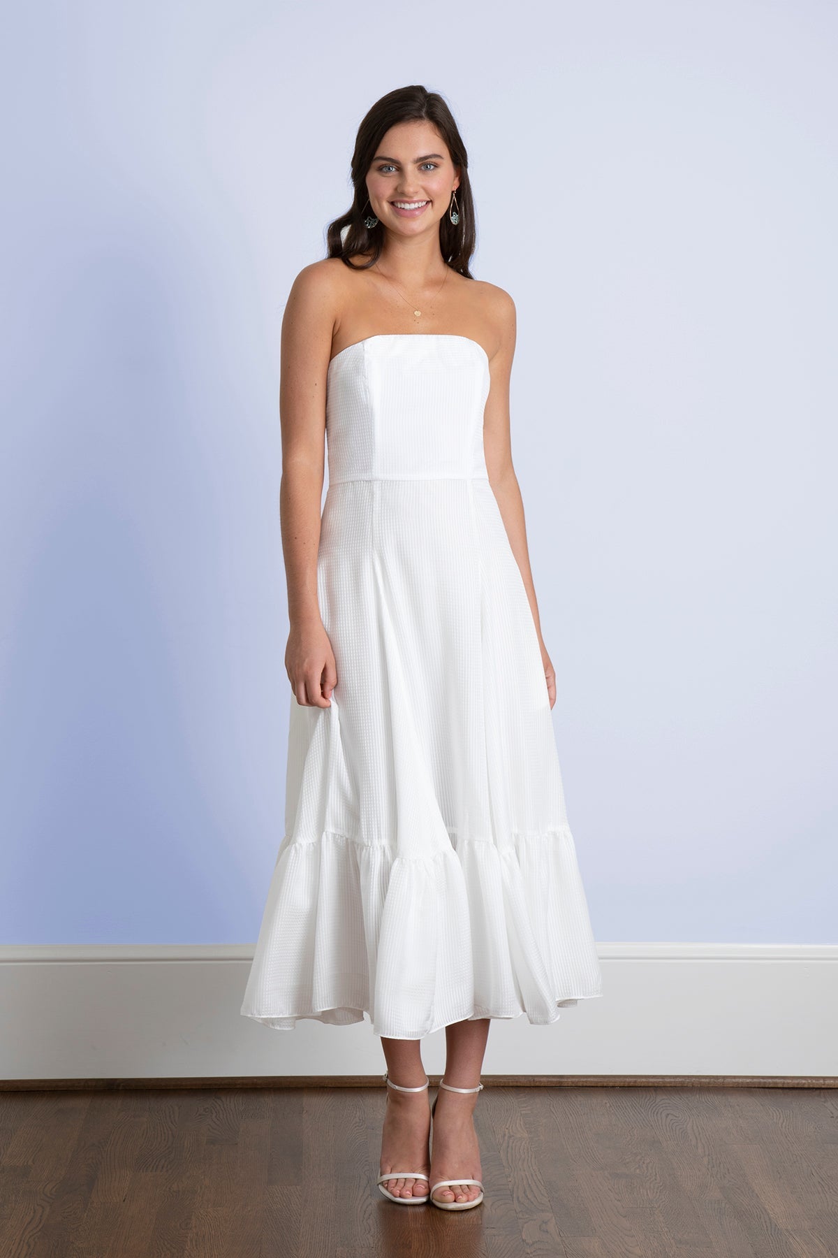 Bride wearing strapless flowy romantic tea length rustic outdoor romantic rehearsal midi wedding dress