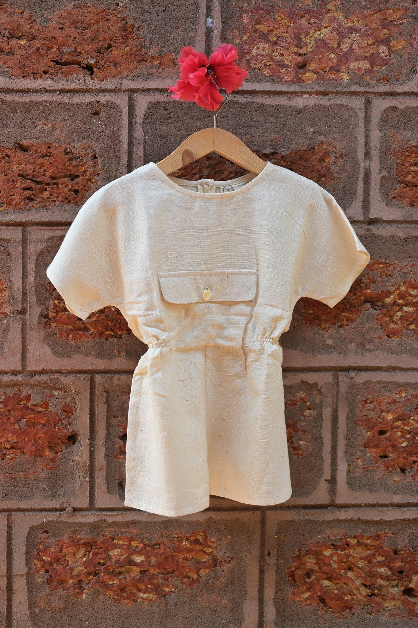 ‘Carry Kindness’ | Unisex jumpsuit with big center pocket in handwoven kora cotton | Rescue