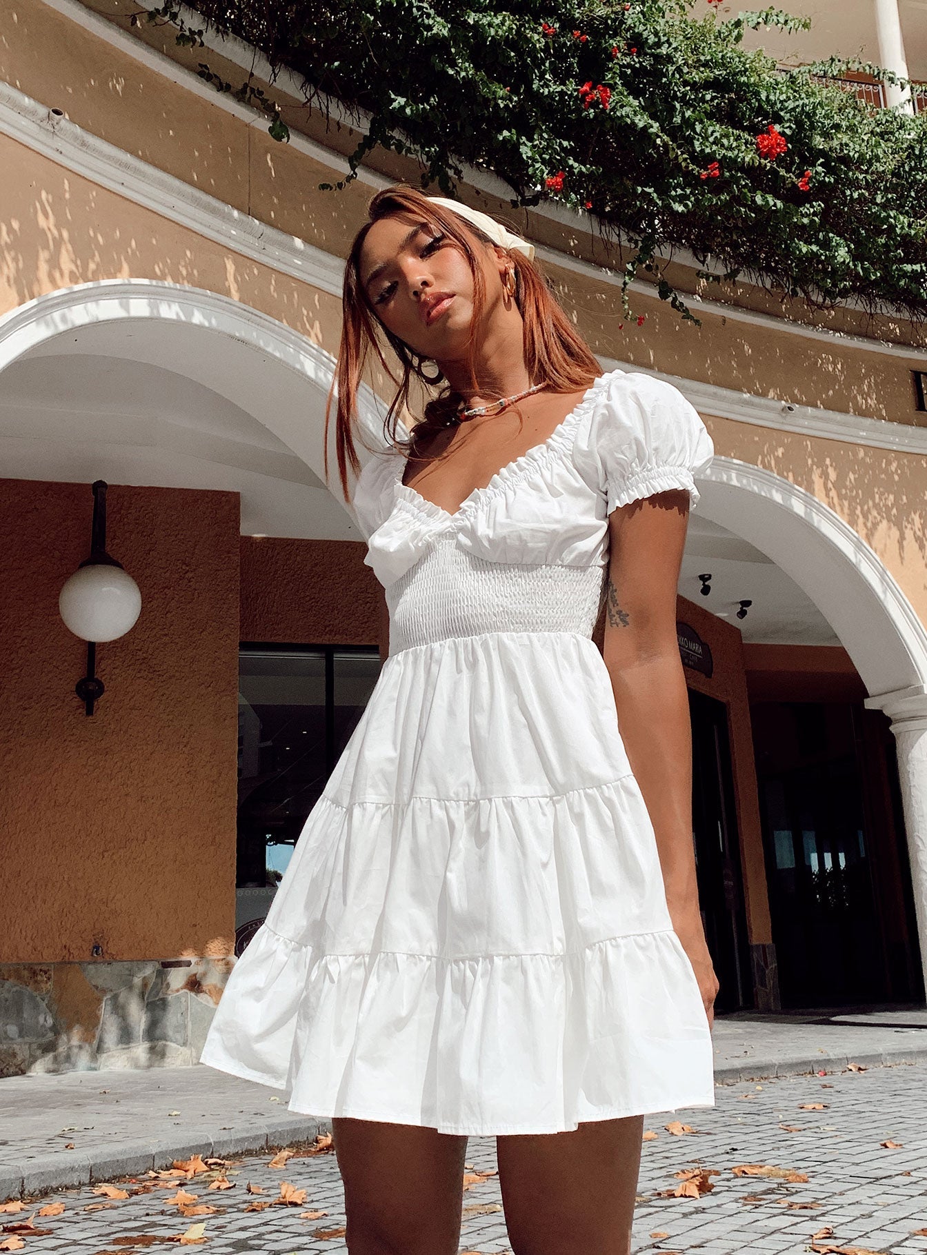 side view of model wearing Princess Polly Daniela Mini Dress White