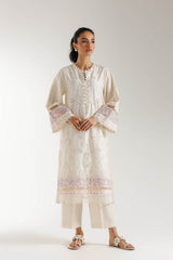Woman wearing off white 2-piece embroidered Lelan suit with full sleeves and floral schiffli embroidery, paired with solid trousers