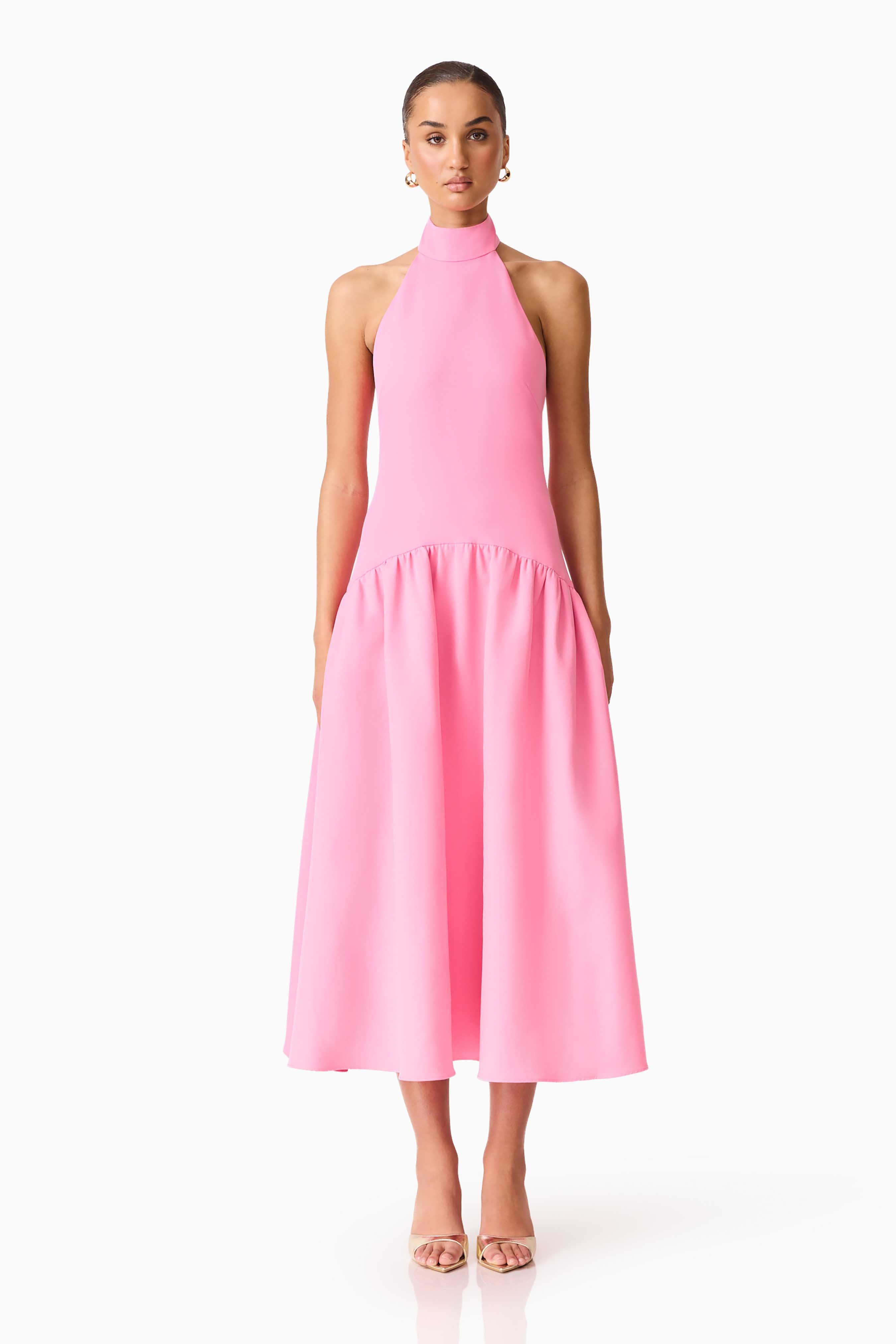 Brunette model wearing The Nolana Halter Midi dress in Pink front shot