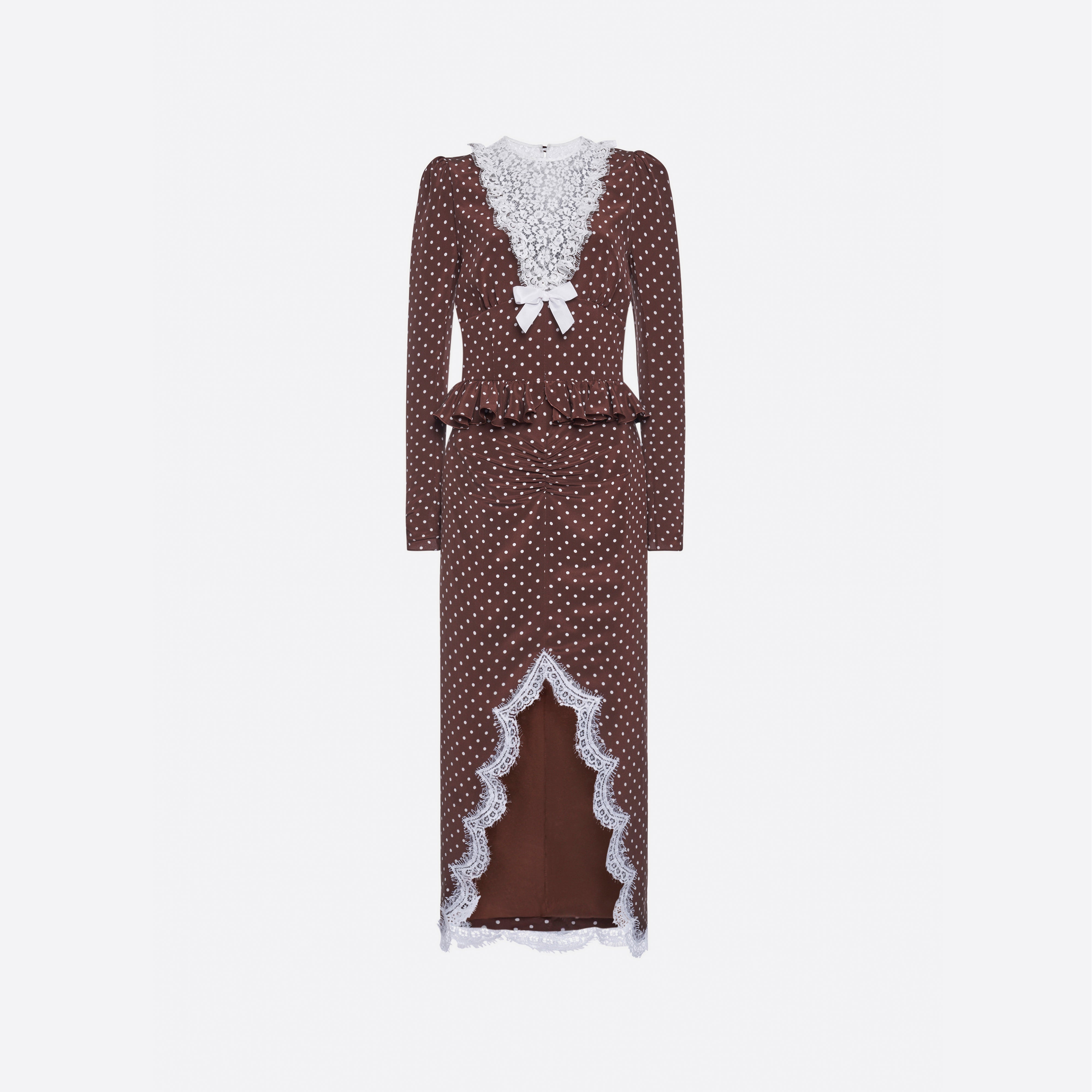 White polka dot print on brown cr√™pe de chine midi dress with long sleeves and lace bib detail, featuring ruffle trim and a lace front slit.