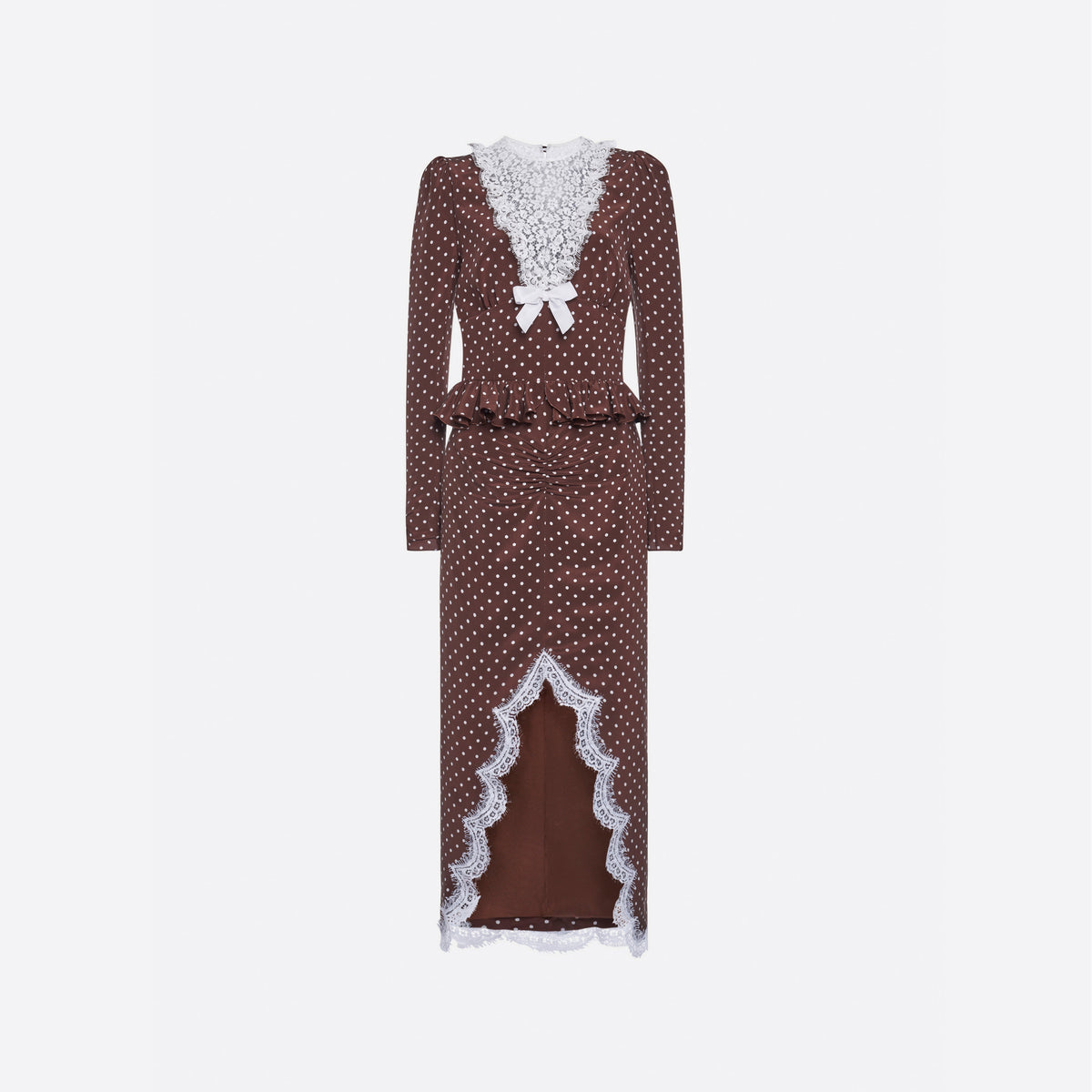 White polka dot print on brown cr√™pe de chine midi dress with long sleeves and lace bib detail, featuring ruffle trim and a lace front slit.