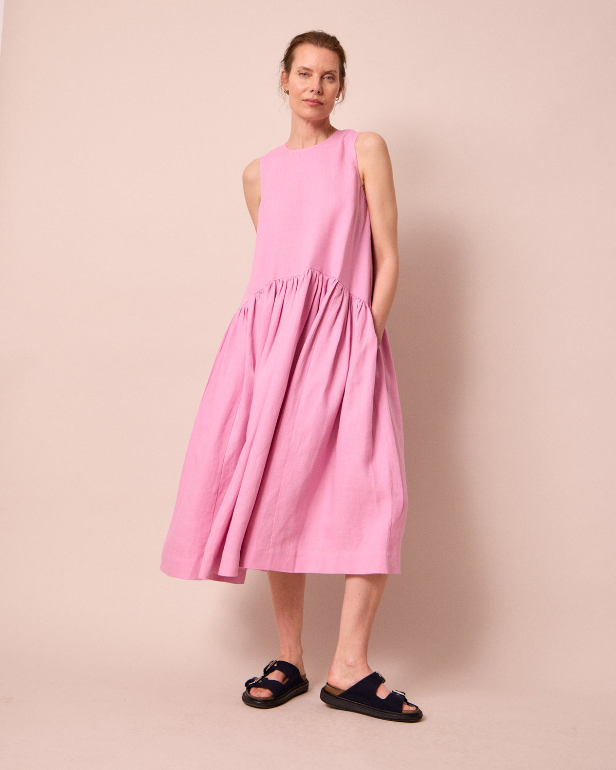 model wears gina rose pink linen dress