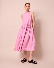 model wears gina rose pink linen dress