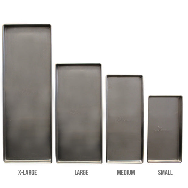 Four rectangular stainless steel trays, labeled X-Large, Large, Medium, and Small, are arranged from tallest to shortest against a white background—ideal for the Harvest Right Home Pro Freeze Dryer Stainless Steel - Medium.