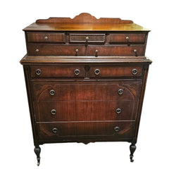 Mahogany Highboy Dresser with Ornate Detailing and Brass Hardware