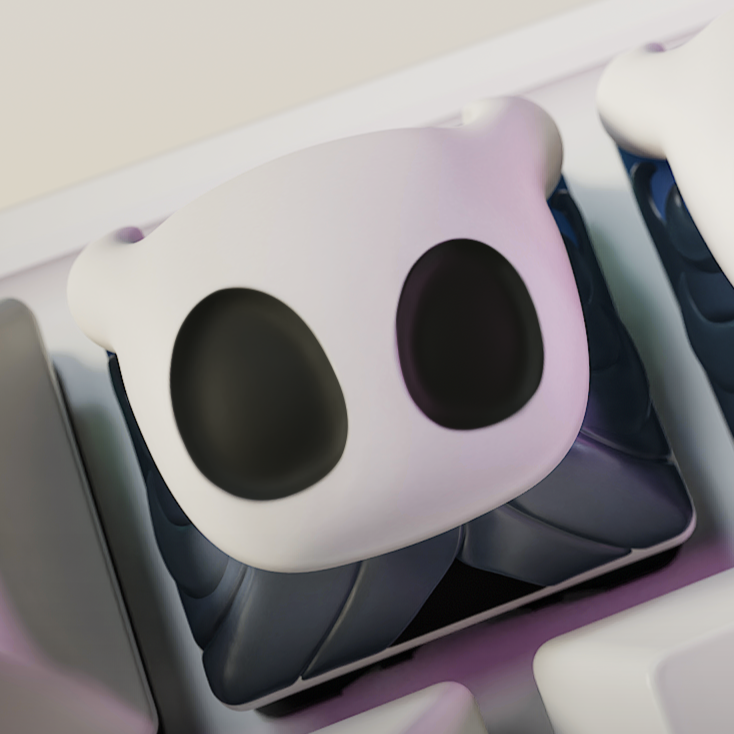 Angled shot of Hollow Knight artisan keycaps installed on a keyboard, highlighting their expressive ghost faces.