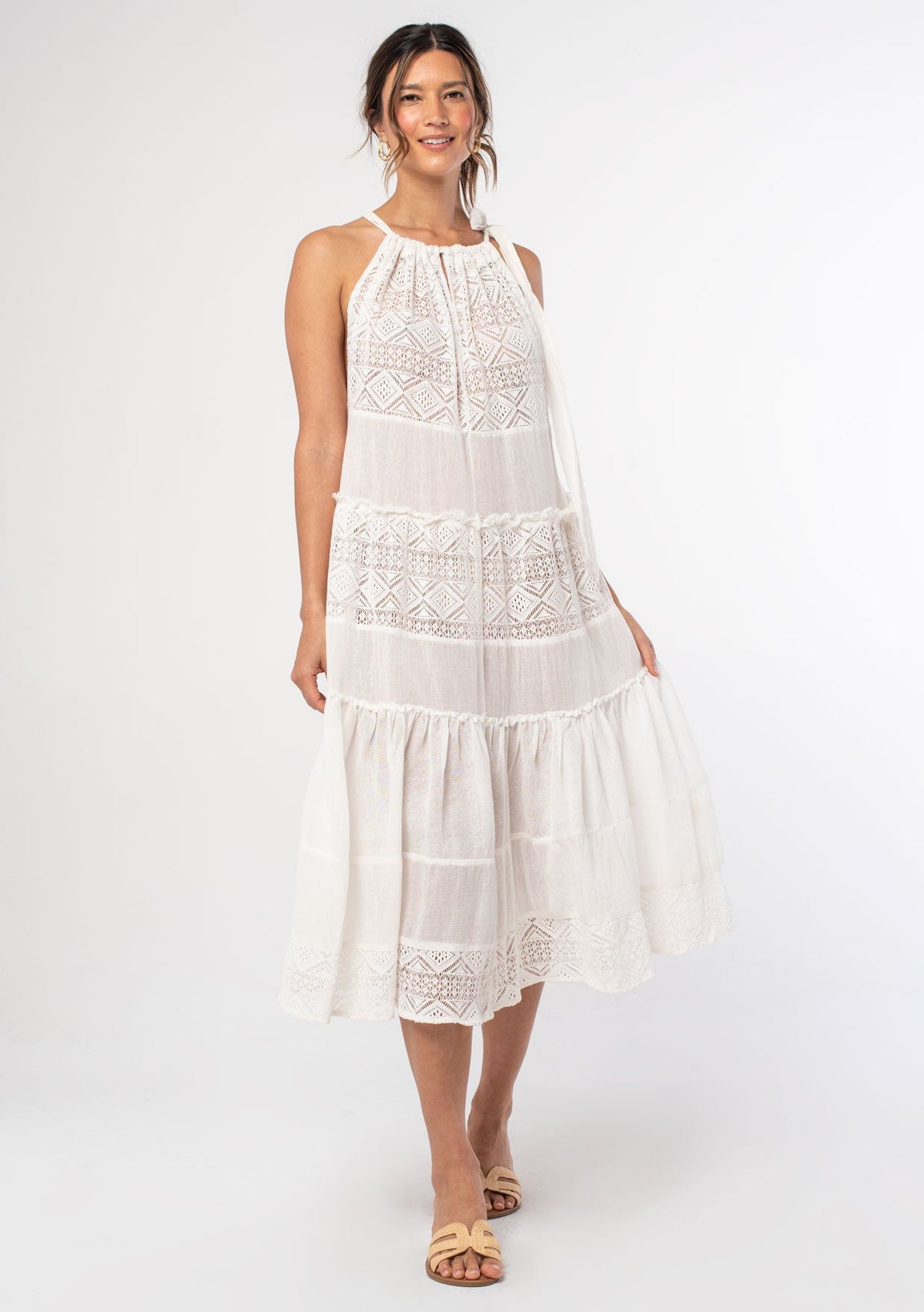 [Color: Bone] A woman wearing a sheer white bohemian midi dress with a tie shoulder detail. A bohemian swim beach cover up dress.
