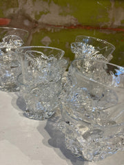 Clear hand-blown glass flower-shaped Vandglas from Marqversen Möglich, showcasing intricate floral design and transparent glass.