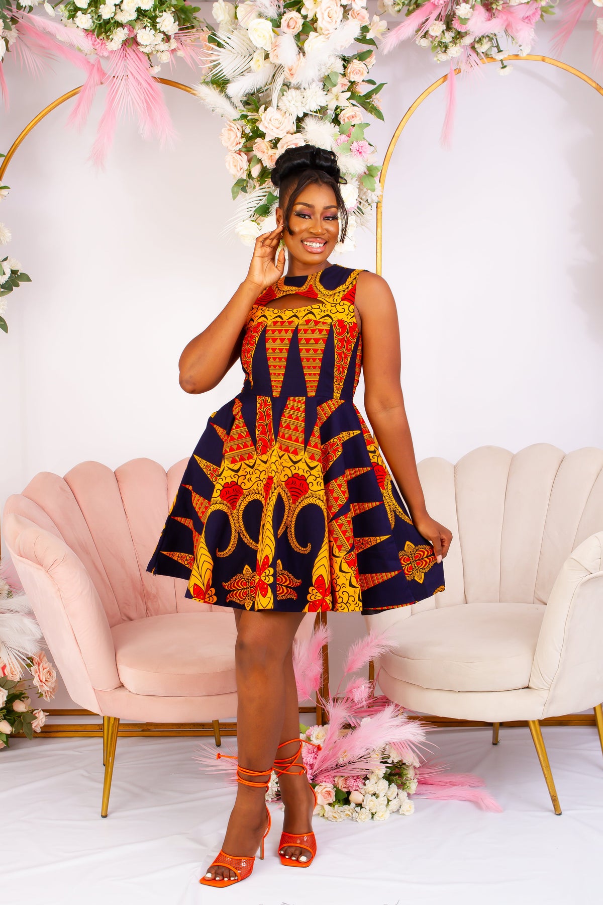 Vibrant Yellow and Navy Blue African Print flare mini dress perfect for a special occasion. Sleeveless with bust cut out for an edgy and chic look. Shop Ghana African print dress | African short dresses | African print gown | African Clothing Online Shop | Maxi African dress | African women's clothing | kitenge dresses | Africa Dresses for Women | African dresses for wedding | Danshiki Dress | Trendy African Dress | African clothing UK