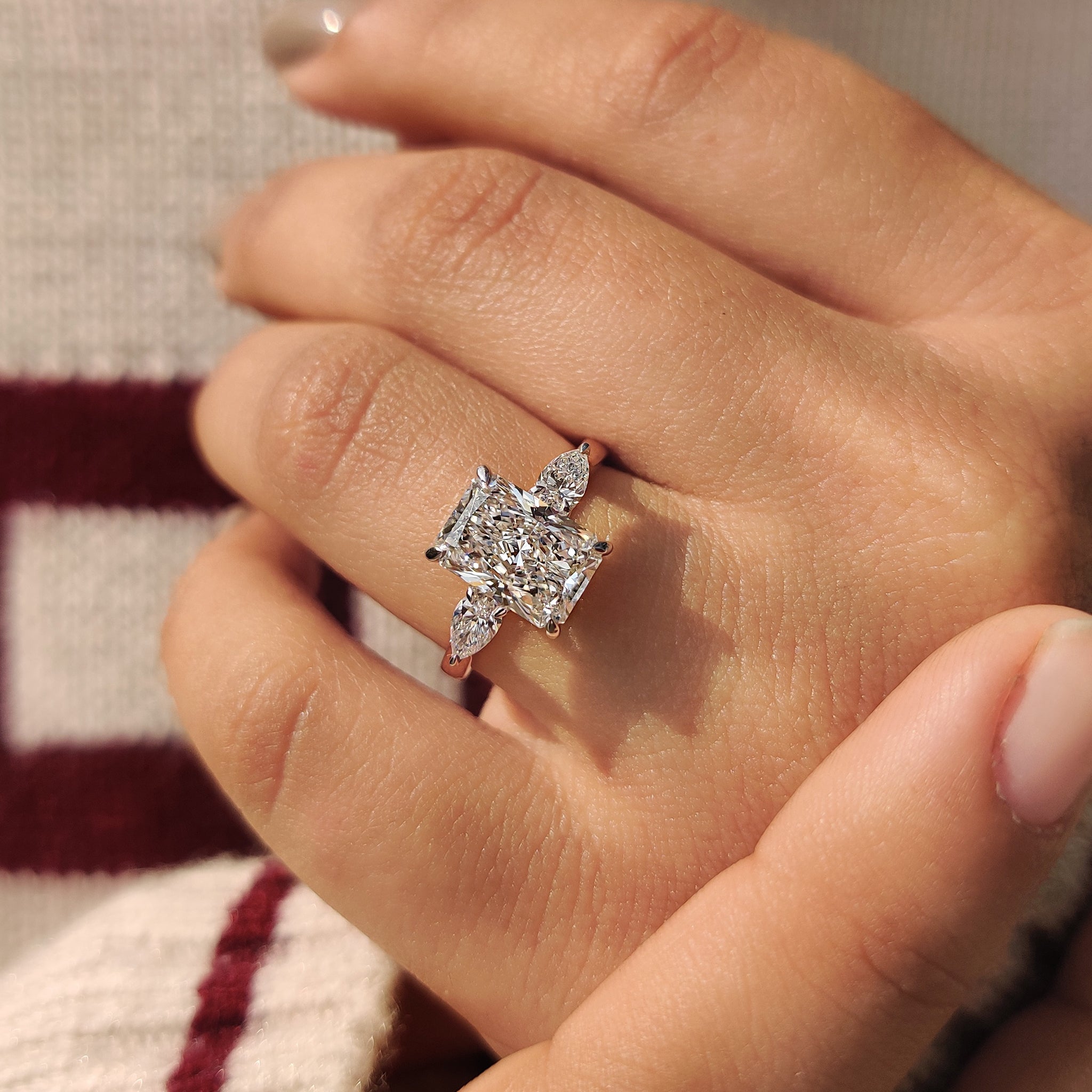 Handmade ring with radiant cut and pear side stone.
