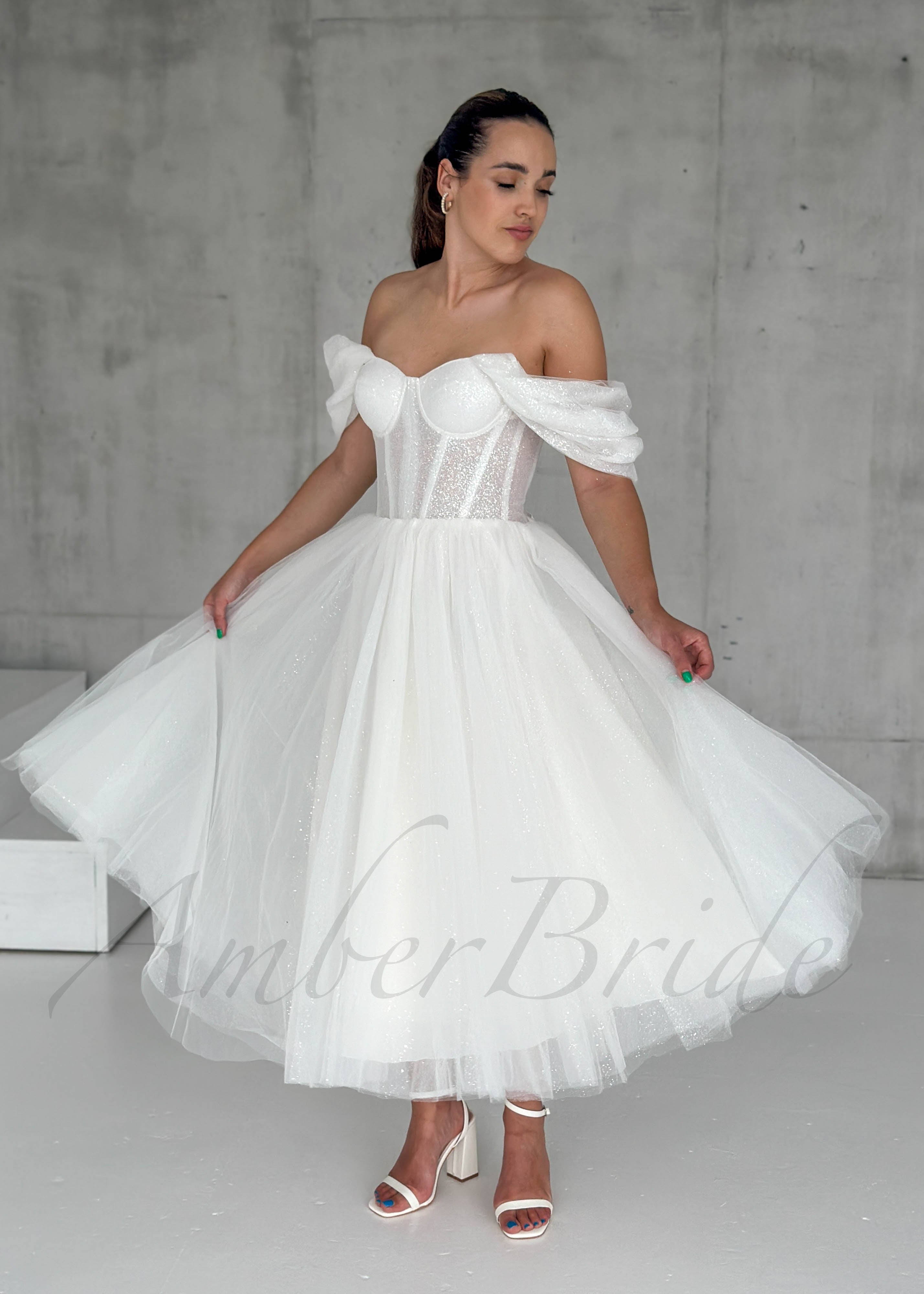 Short Glittery Tulle Off-Shoulder Dress with Lace-Up Closure – front view | AmberBride