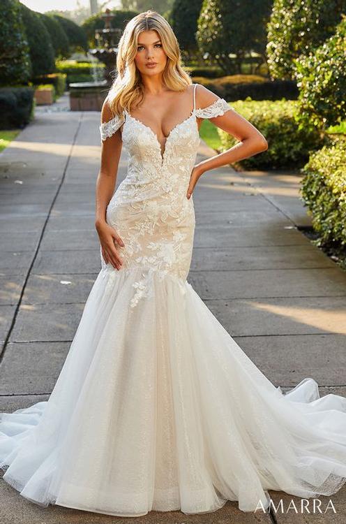 Amarra Bridal Alexa 84398 Lace Mermaid off the shoulder Wedding Gown Train V Neck Look and feel like a beautiful mermaid in this mermaid-style wedding gown. Fitted at the bodice, Alexa dramatically flares out into a flowy skirt that captivates and dazzles. Featuring a deep-V neckline and beautiful floral lace appliques, this dress is full of intricate detail that’s sure to have all eyes on you.