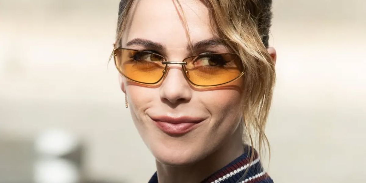 Kiernan Shipka is seen wearing Miu Miu MU A50S 5AK7R1 sunglasses to attend the brand's Spring/Summer 2025 fashion show in Paris