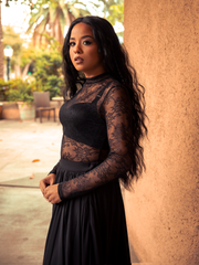 Whispering of midnight secrets, the Lace Base Top in Black layers delicate lace over soft fabric, perfect for both daring evenings and casual dark romance. Available XS–4X.