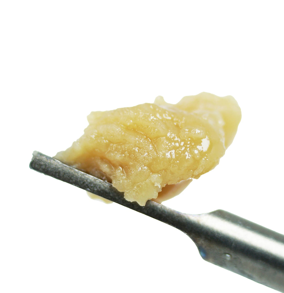 A metal dab tool holds golden Papaya Melonz 90u THCa Hash Rosin by roz from frasier against a white background, showcasing its tropical fruity flavor and potential stress-relieving effects.