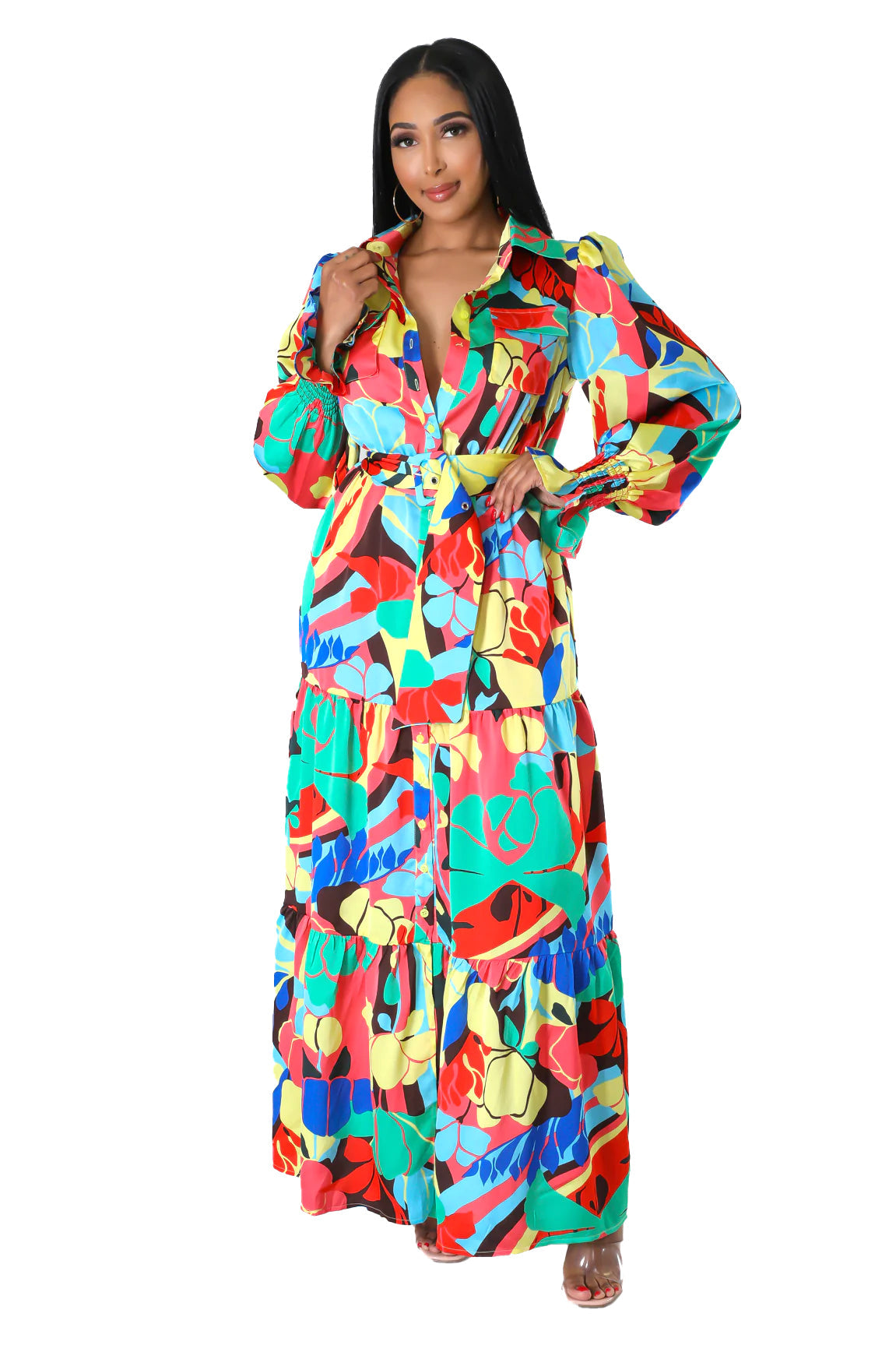 a woman in a colorful dress posing for a picture