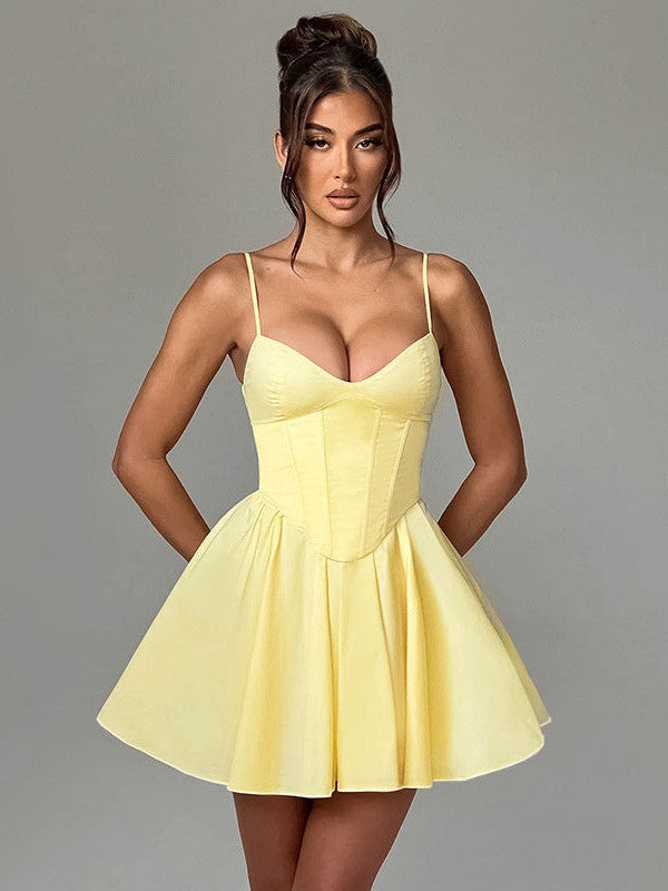Yellow boned corset bodice dress with spaghetti straps, cinched waist, and short flared A-line skirt.