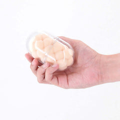 Pocket Pals Handy Stroker Bubbles White held in a hand, showcasing its compact design and bubble-textured interior.