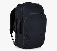 A Black Travel backpack with multiple compartments and the brand name 'Pakt' embroidered on the front pocket.