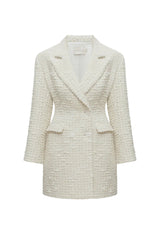 Undress Petra creamy tweed mini blazer dress shown on a model, featuring a tailored fit with classic lapels and long sleeves.