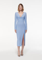A photograph of a woman wearing a Long Sleeve Crepe Midi Dress Light in Blue