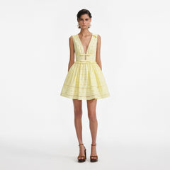 Front view of a woman wearing the Yellow Cotton Broderie Mini Dress [hover]