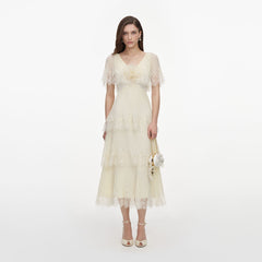 Front view of a woman wearing the Yellow Chiffon Tiered Midi Dress
