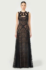 Massima Patchwork Lace Gown in black with intricate lace detailing, sleeveless design, and cutout accents. A floor-length elegant dress for special occasions.