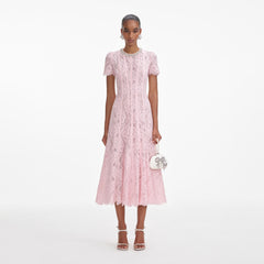 Front view of a woman wearing the Pink Lace Embellished Midi Dress