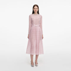 Front view of a woman wearing the Pink Organza Lace Midi Dress