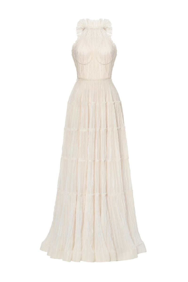 Ivory tiered halter maxi dress by Montsand featuring flowy fabric and a sleeveless design, perfect for elegant summer occasions.