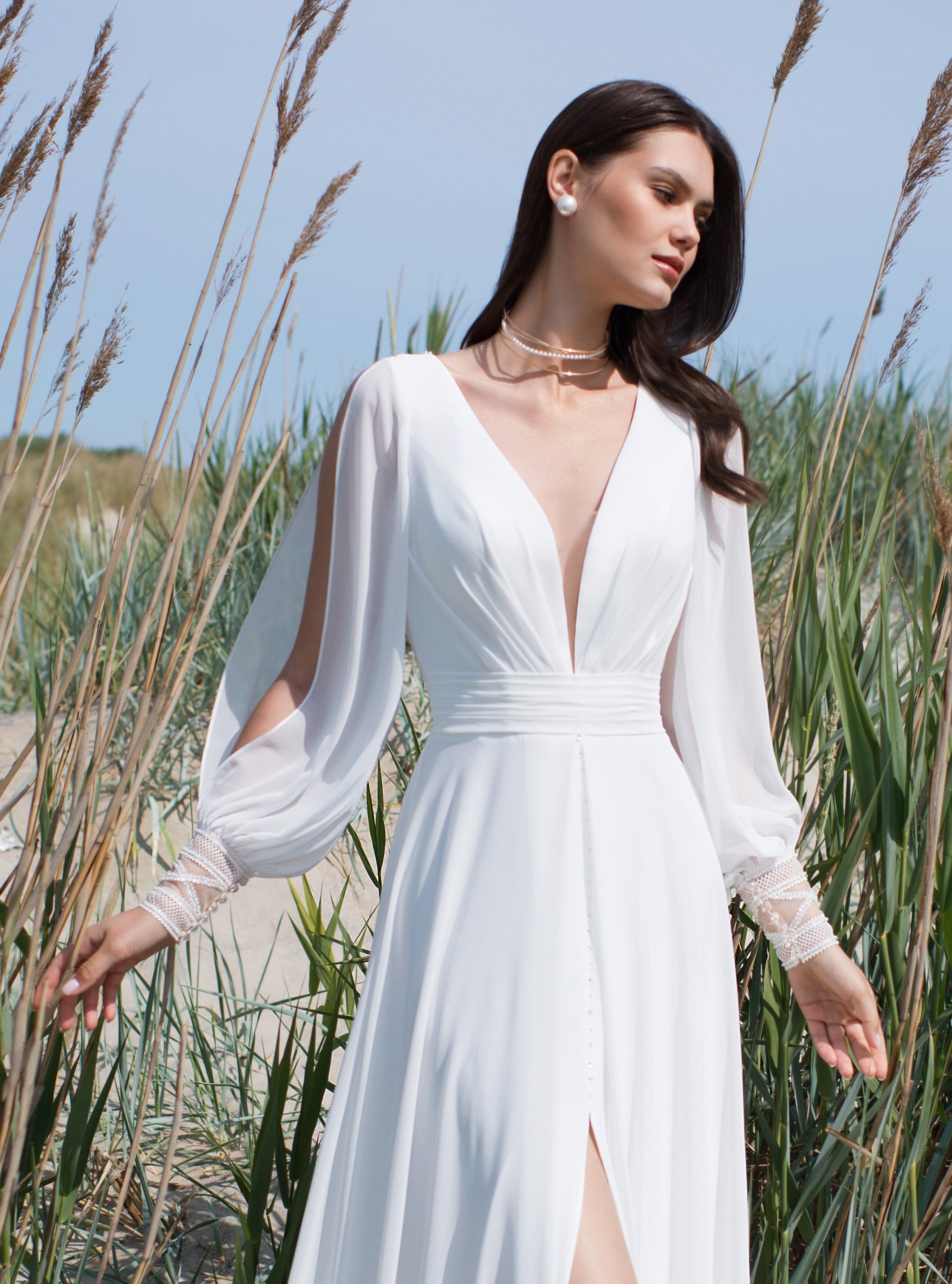 Long Sleeve Wedding Dress with a Front Slit and Back Details