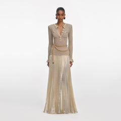 Front view of a woman wearing the Gold Lurex Ribbed Knit Maxi Dress