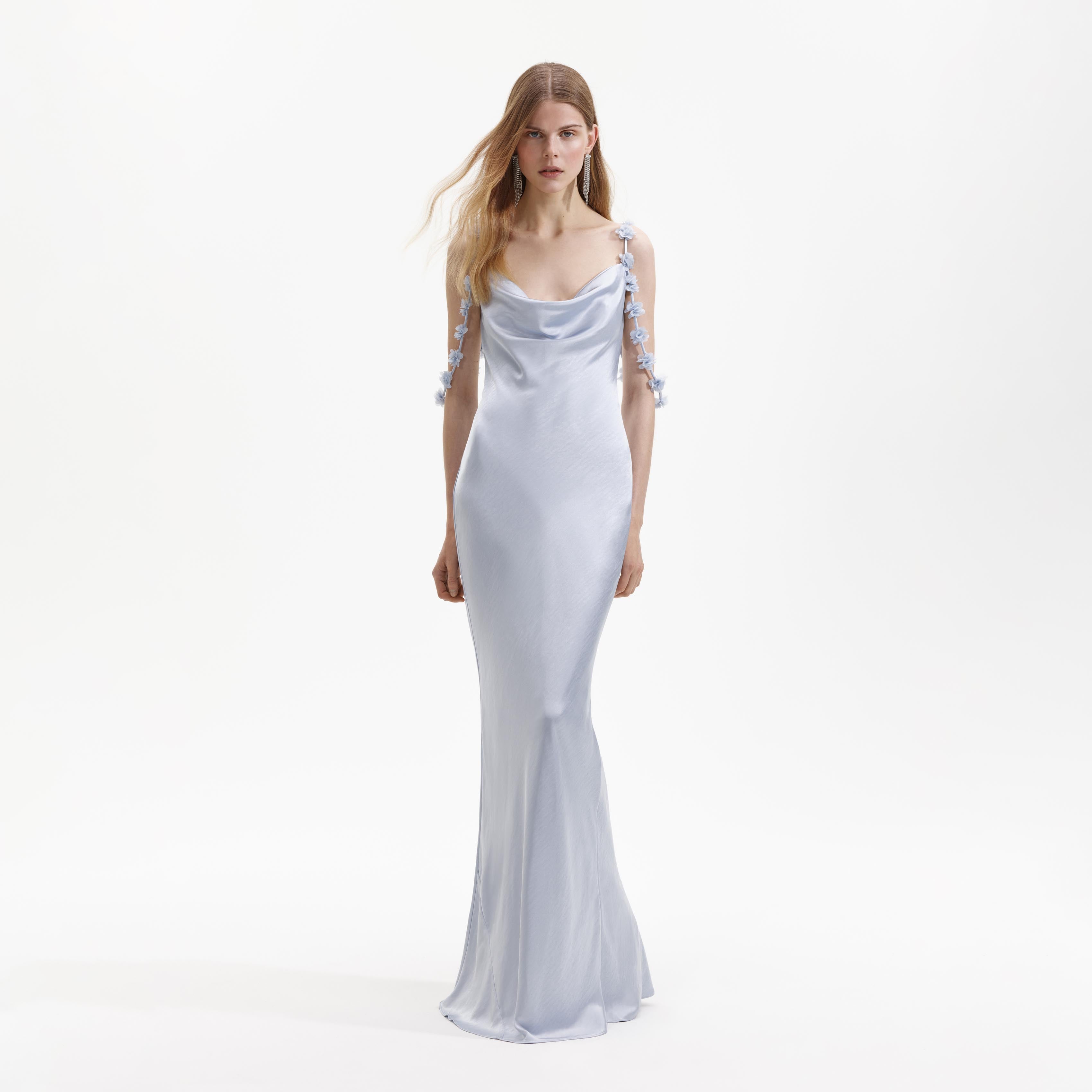 Front view of a woman wearing the Blue Satin Flower Maxi Dress