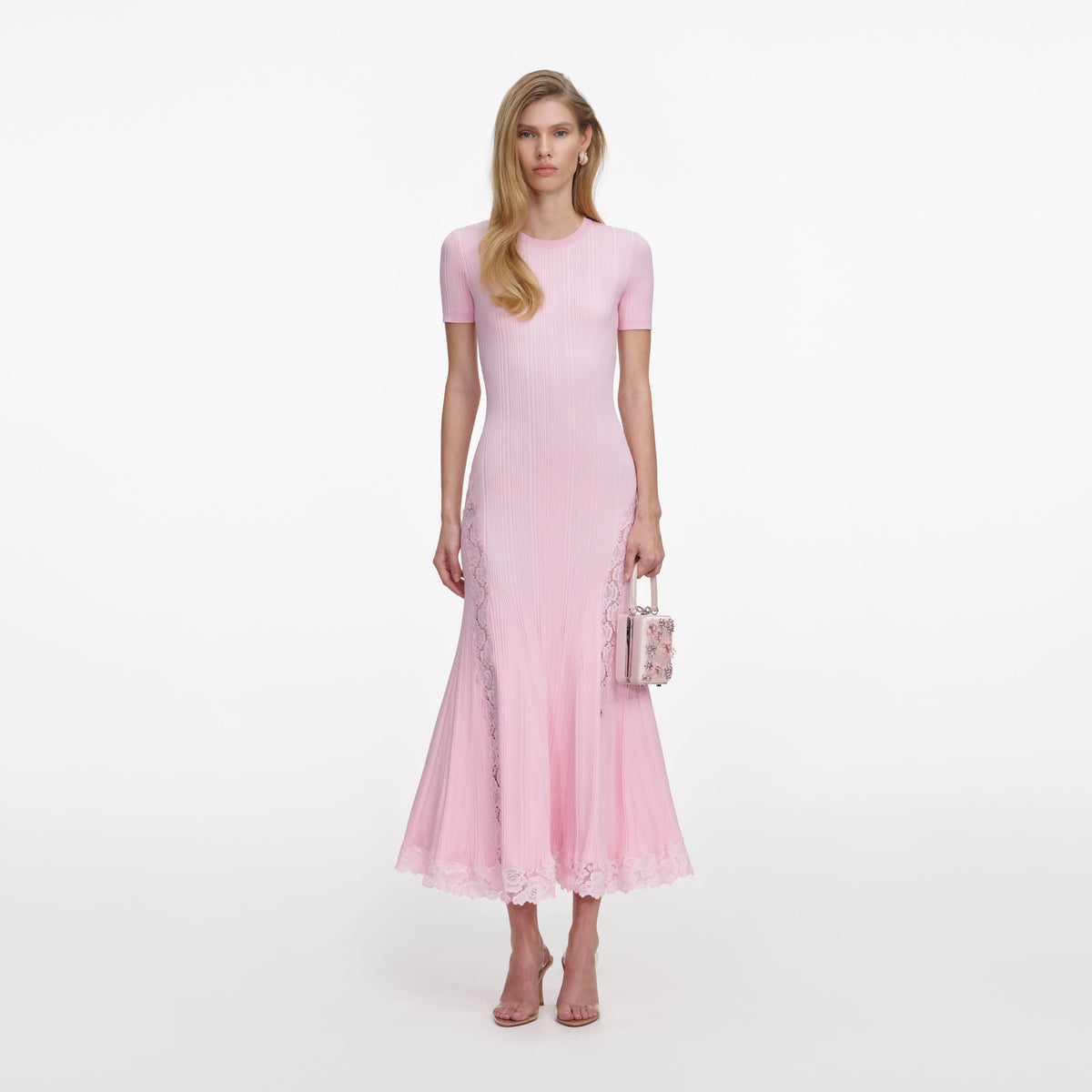 Front view of a woman wearing the Pink Knit Lace Insert Midi Dress