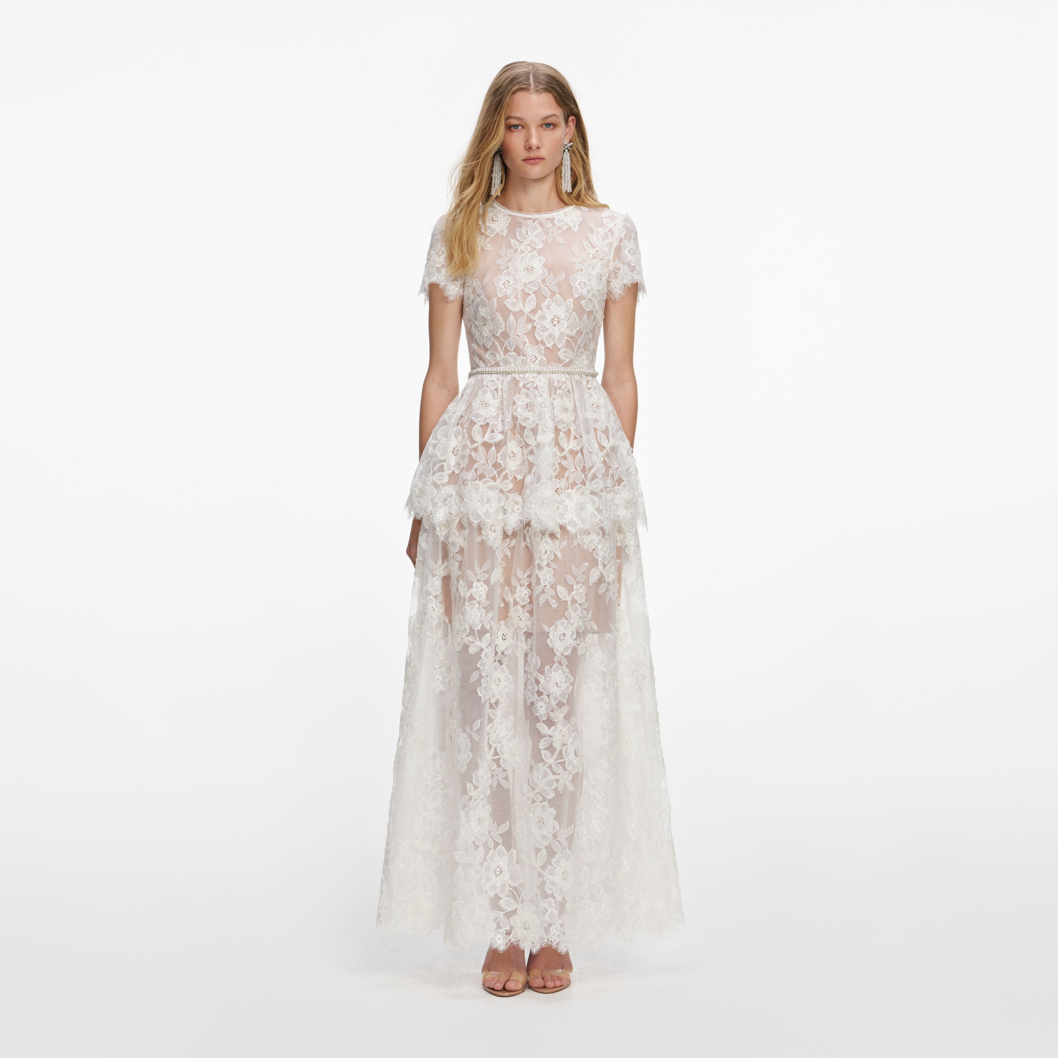 Front view of a woman wearing the White Sequin Lace Tiered Maxi Dress