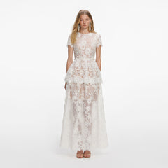 Front view of a woman wearing the White Sequin Lace Tiered Maxi Dress