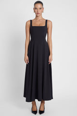 Model is wearing Serenity Square Neck Corset Midi Dress Black, front view.