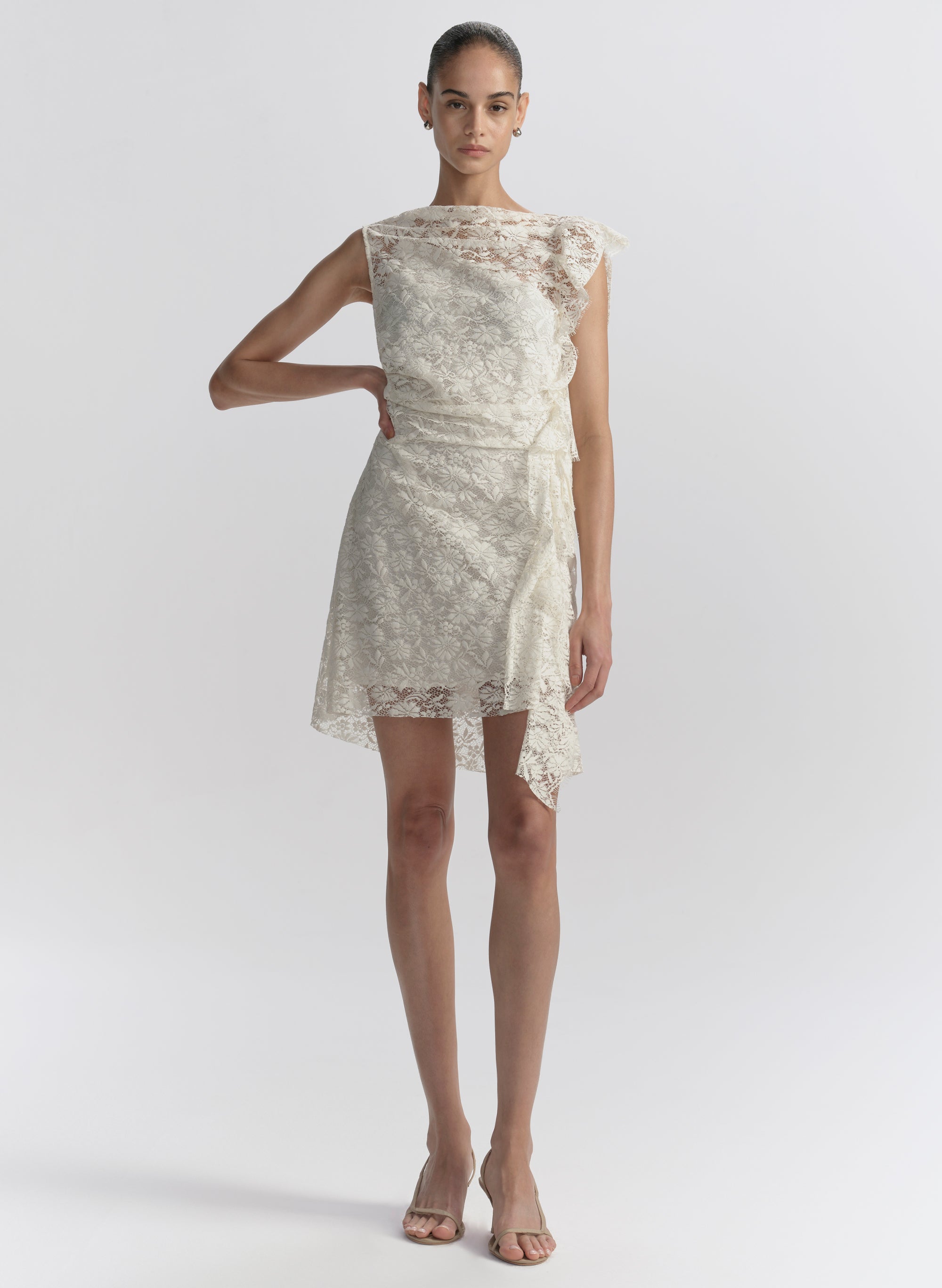woman wearing white lace mini dress