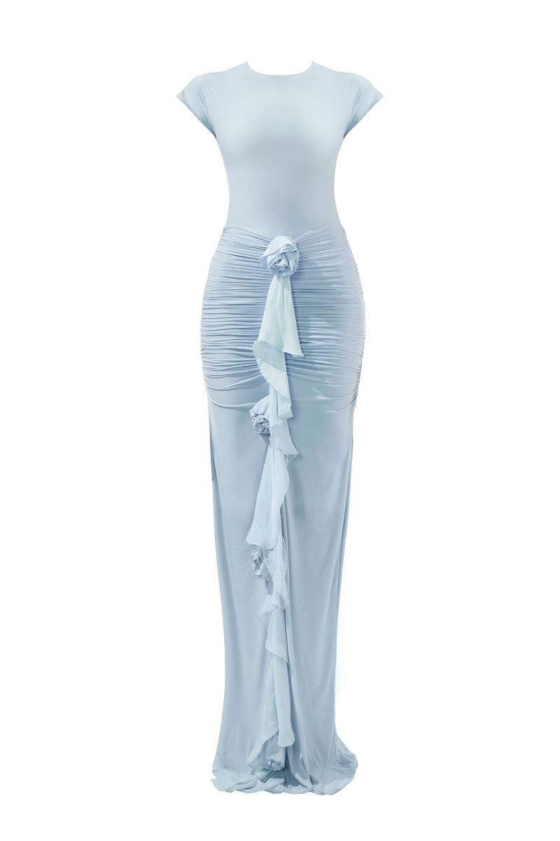 Deme By Gabriella Skye baby blue fitted backless maxi dress displayed on a hanger, showcasing its elegant design and flowing fabric.