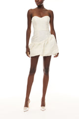 Monique Lhuillier Spring 2026 Ivory Botanical Matelassé Strapless dress with
asymmetric bubble skirt -front.